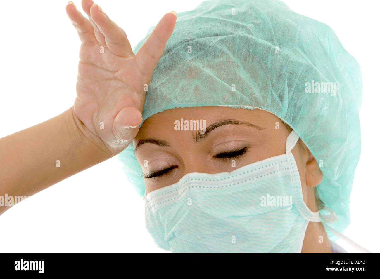 Ärztin mit Mundschutz und Schutzhaube, female doctor with surgical mask Stock Photo