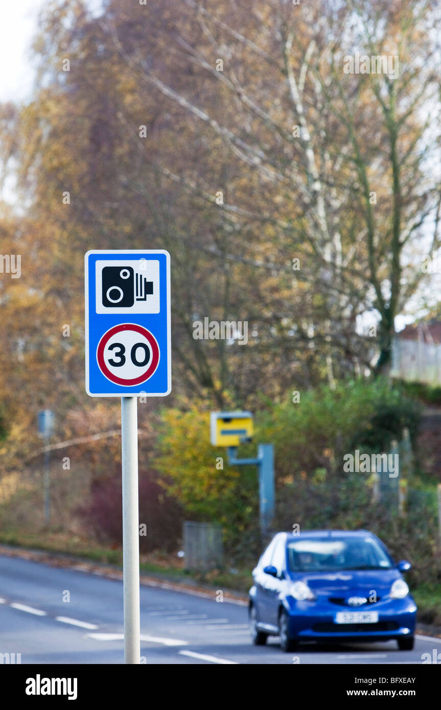 Speed camera and warning sign Stock Photo Alamy
