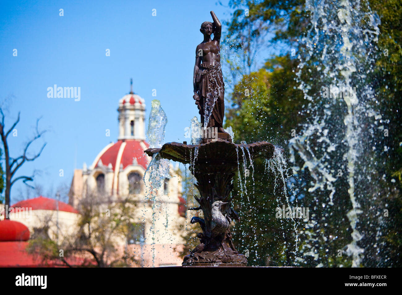 Fountain and Church of San Juan de Dios in Alameda Central in Mexico CIty Stock Photo