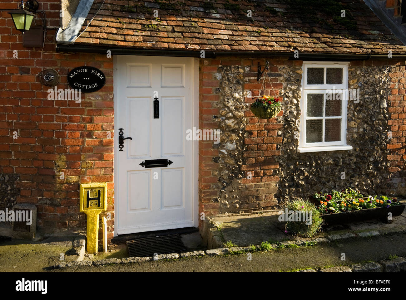 A traditional brick and flint cottage in the rural village Little