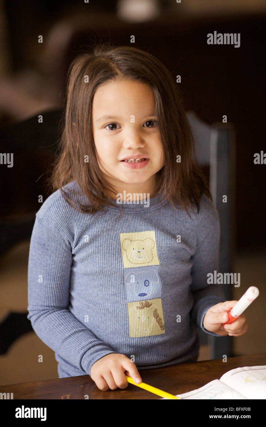 Four year old girl with marker and pencil Stock Photo Alamy
