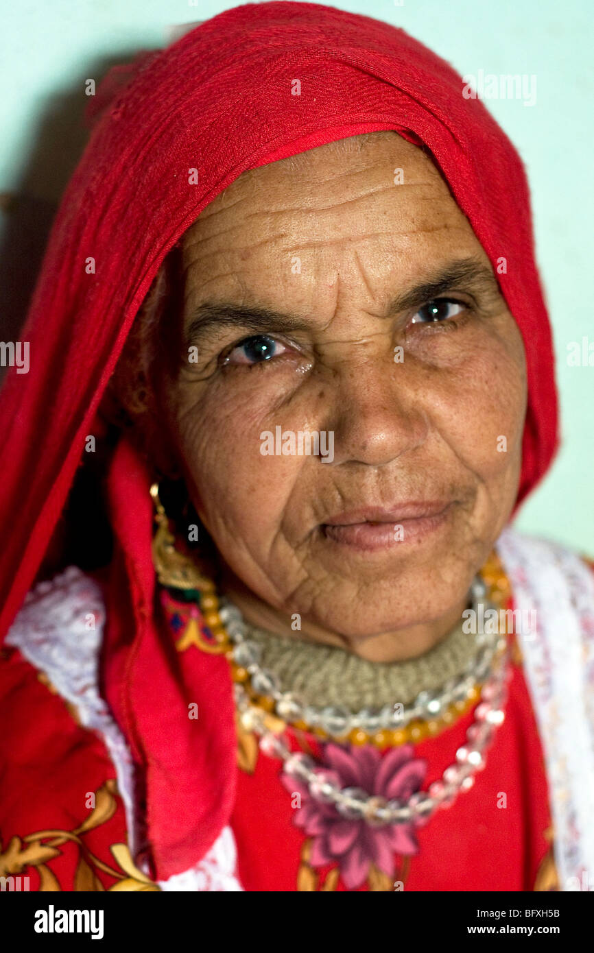 A closeup facial portrait of an elderly Middle Eastern, Egyptian Arab Bedouin woman, in Farafra Oasis, in the New Valley, Western Desert, Egypt. Stock Photo