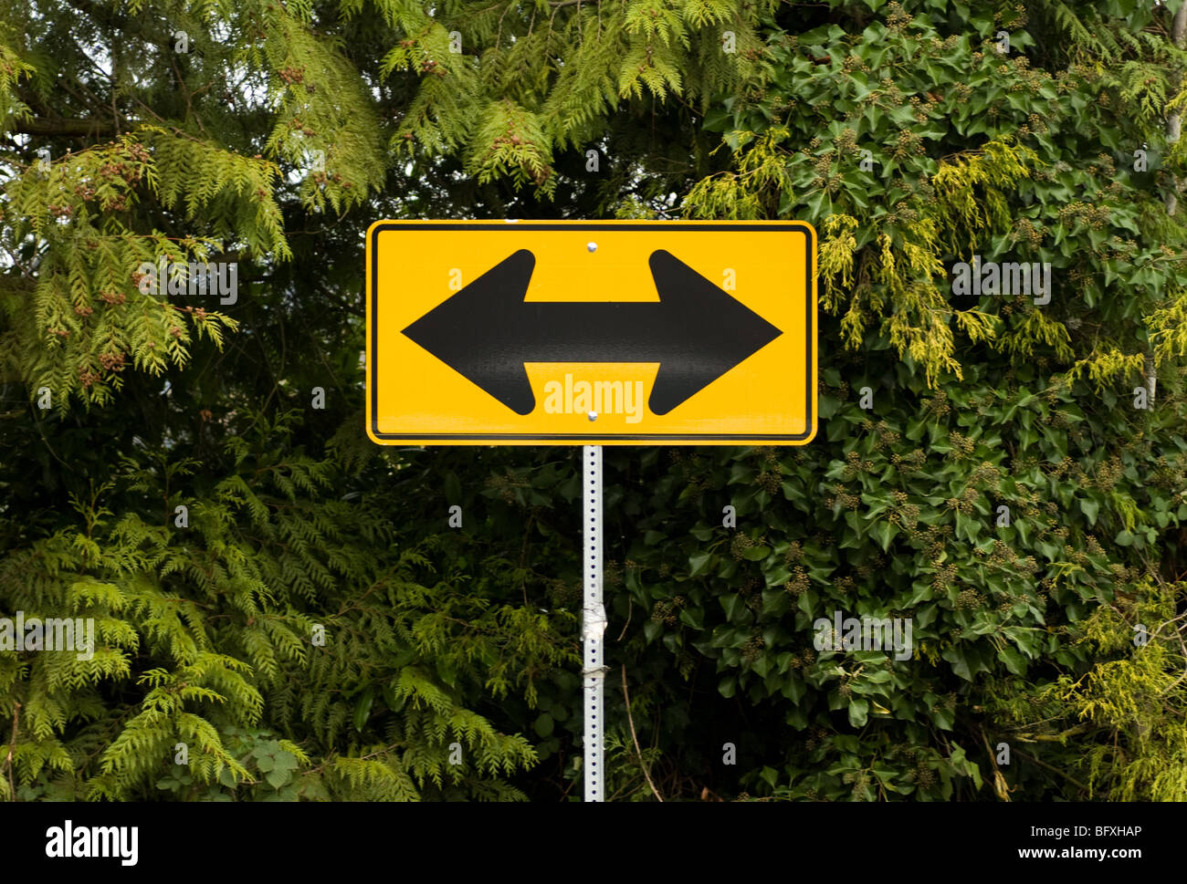 Two way arrow traffic sign Stock Photo