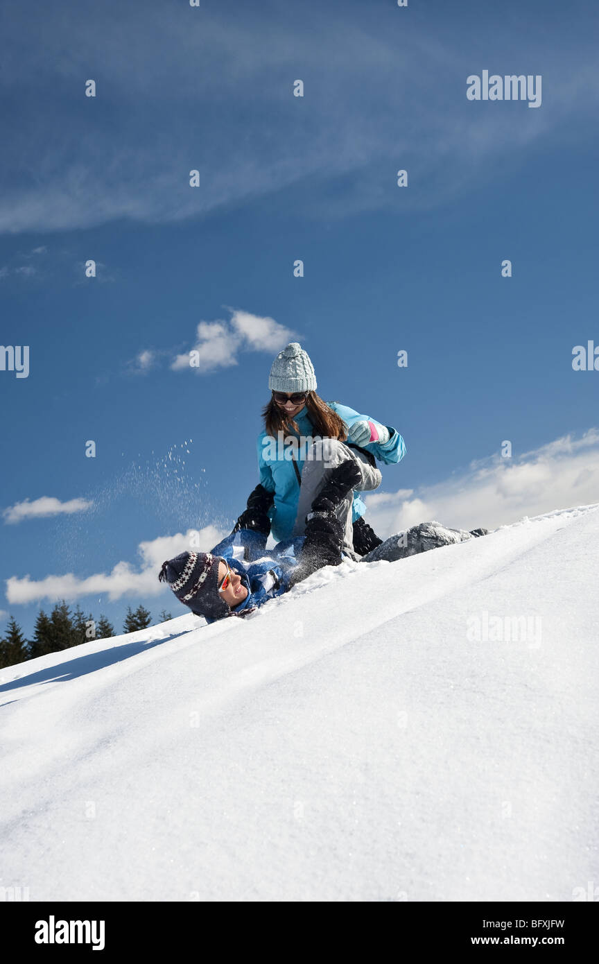 Couple playing with snow Stock Photo