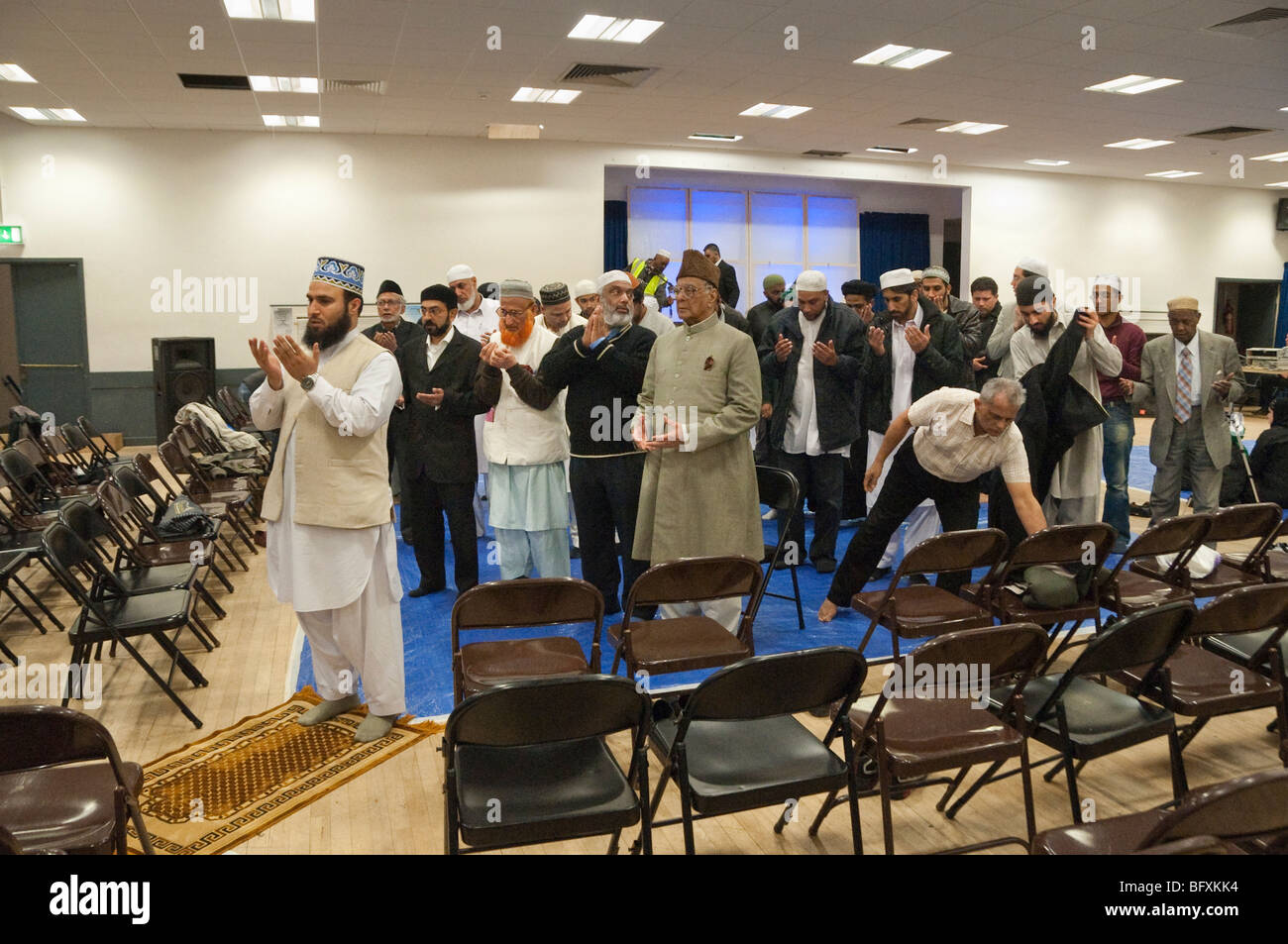 Men at prayers at Eid Milad-Un-Nabi Celebrations at Sunni Muslim Association, Tooting, London. Stock Photo