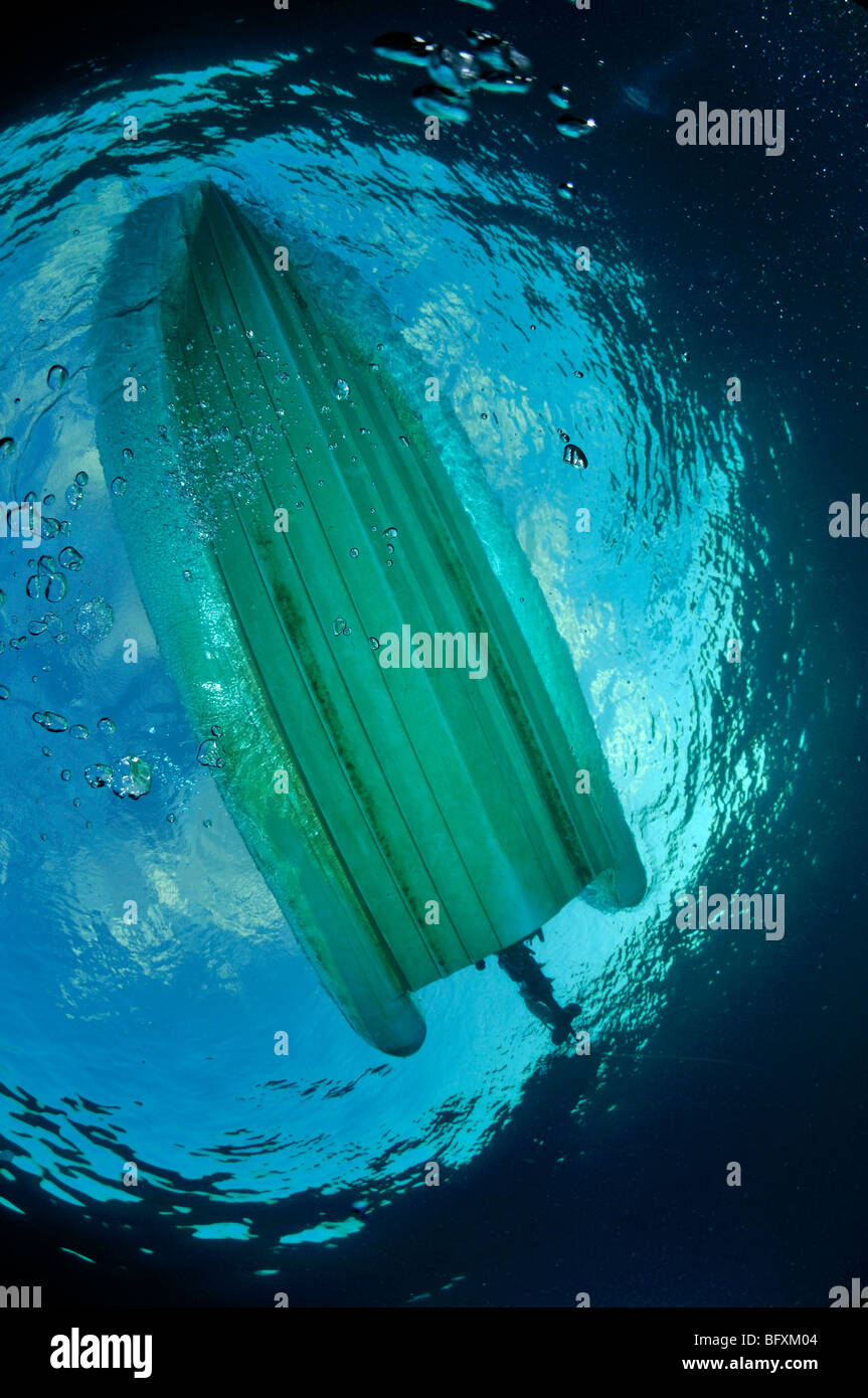 Underwater view of bottom of boat looking up through Snell's window Stock Photo