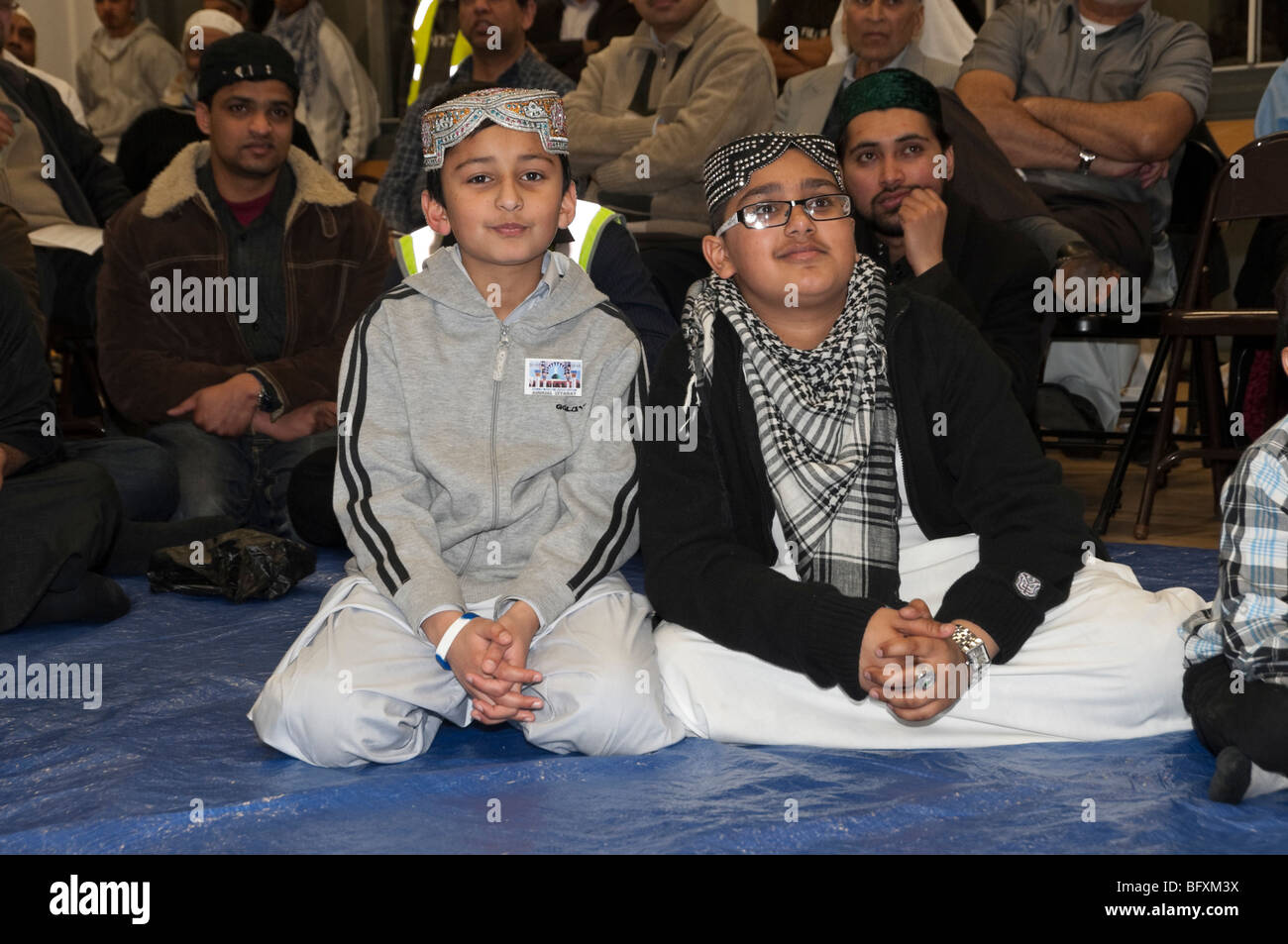 Children watch talent show at Eid Milad-Un-Nabi Celebrations at Sunni Muslim Association, Tooting, London. Stock Photo