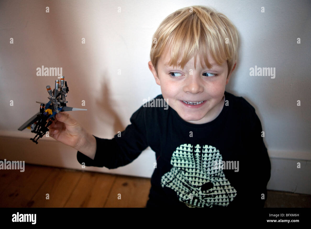 Boy playing with toy vehicle Stock Photo - Alamy
