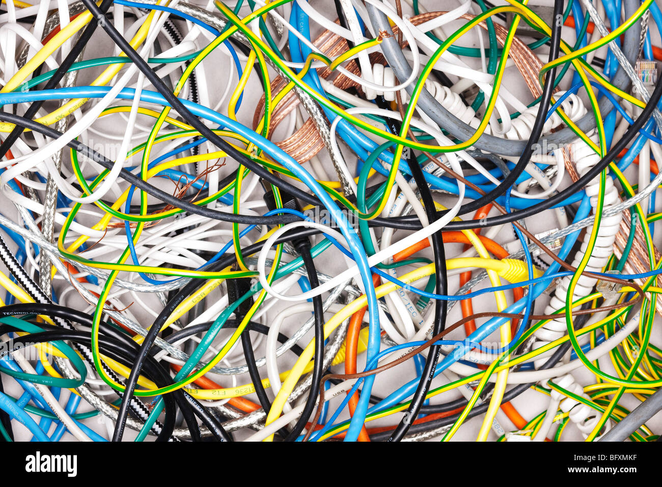 A tangle of colored wires on the ground Stock Photo