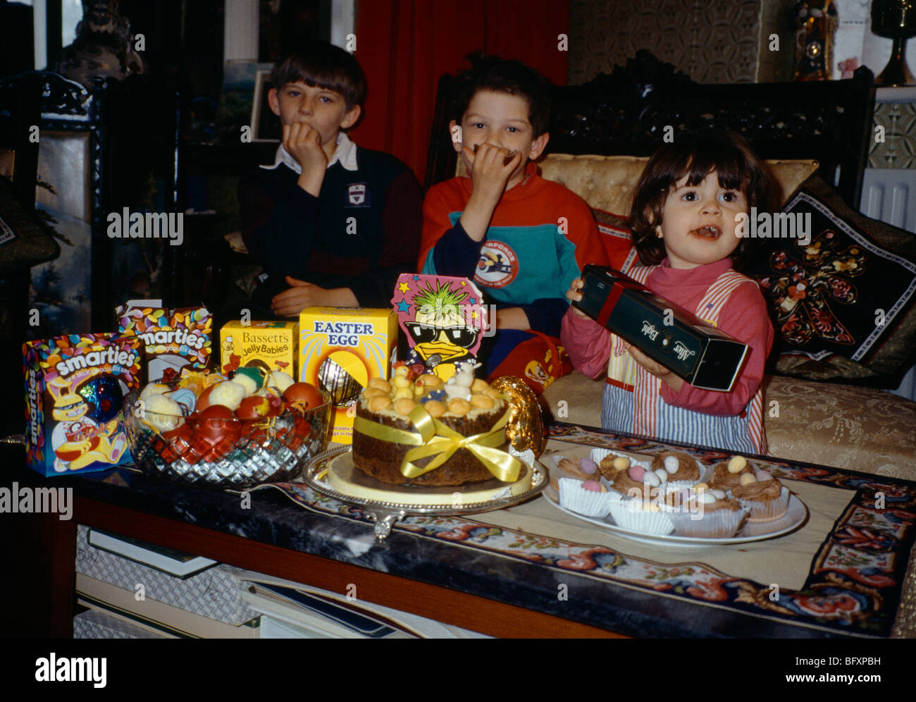Easter Children Eating Eggs Eggs And Cakes Stock Photo Alamy