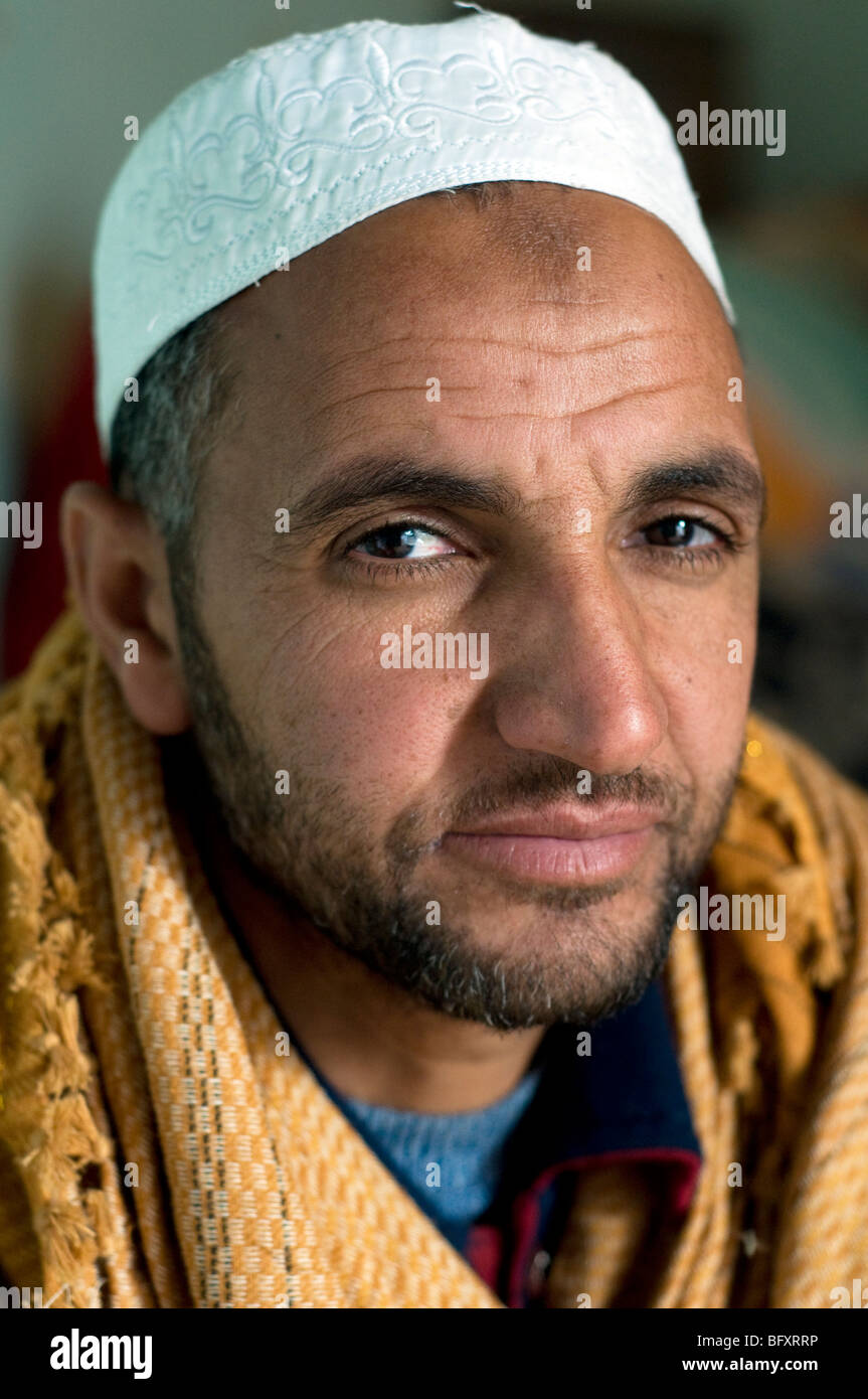 A closeup facial portrait of a young Middle Eastern, Egyptian Arab Bedouin man, living in Farafra Oasis, in the New Valley, Western Desert, Egypt. Stock Photo