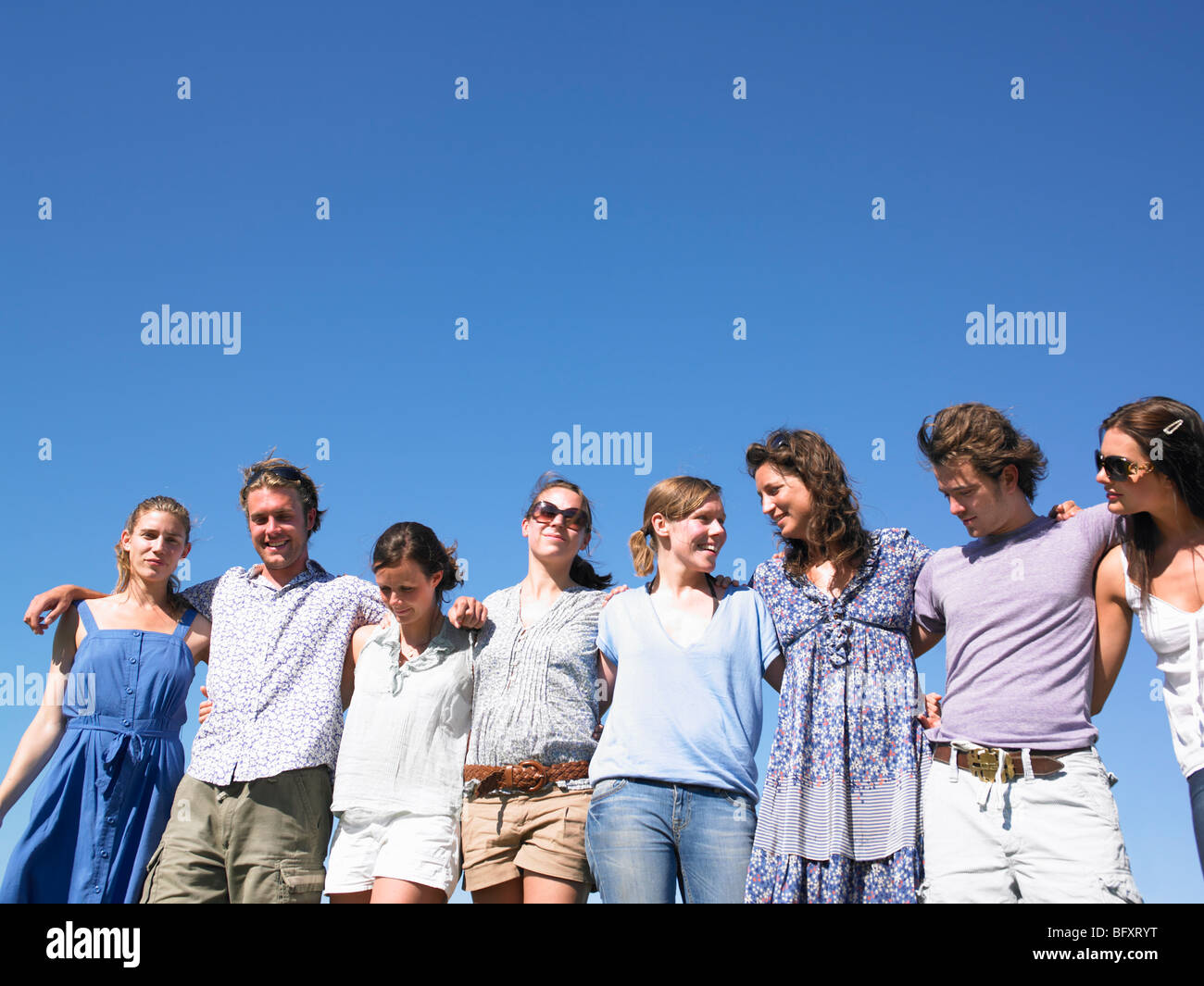 group of young people walking in field Stock Photo - Alamy