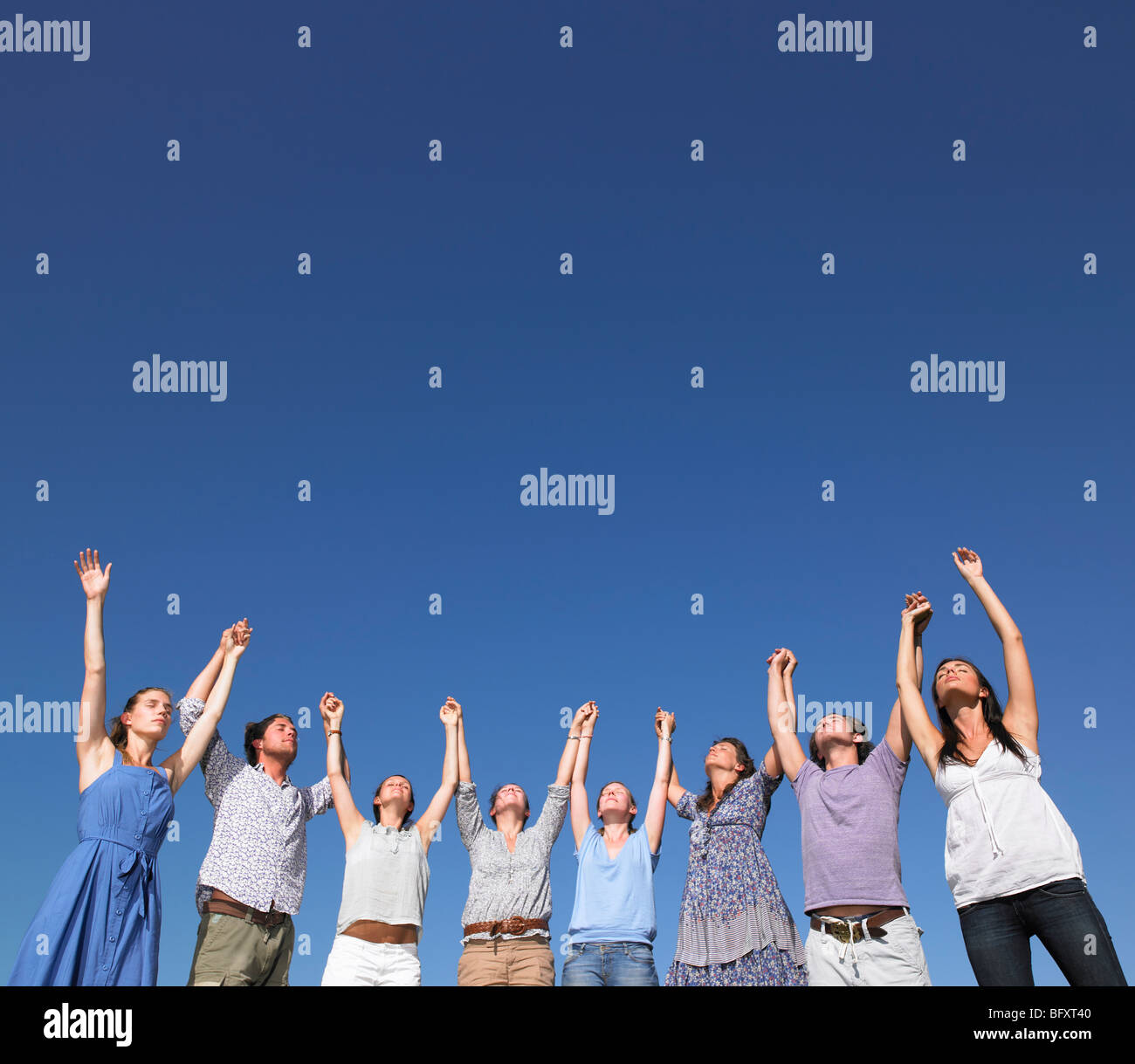 group of young people raising arms Stock Photo - Alamy