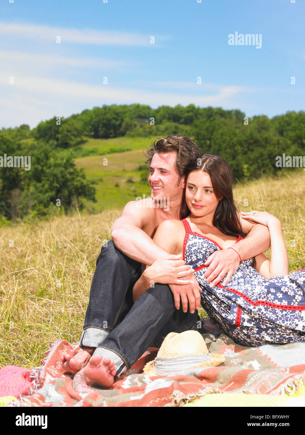 couple on blanket in field Stock Photo Alamy