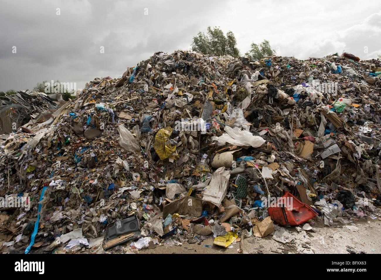 Piles of rubbish at a materials recycling facility in England Stock