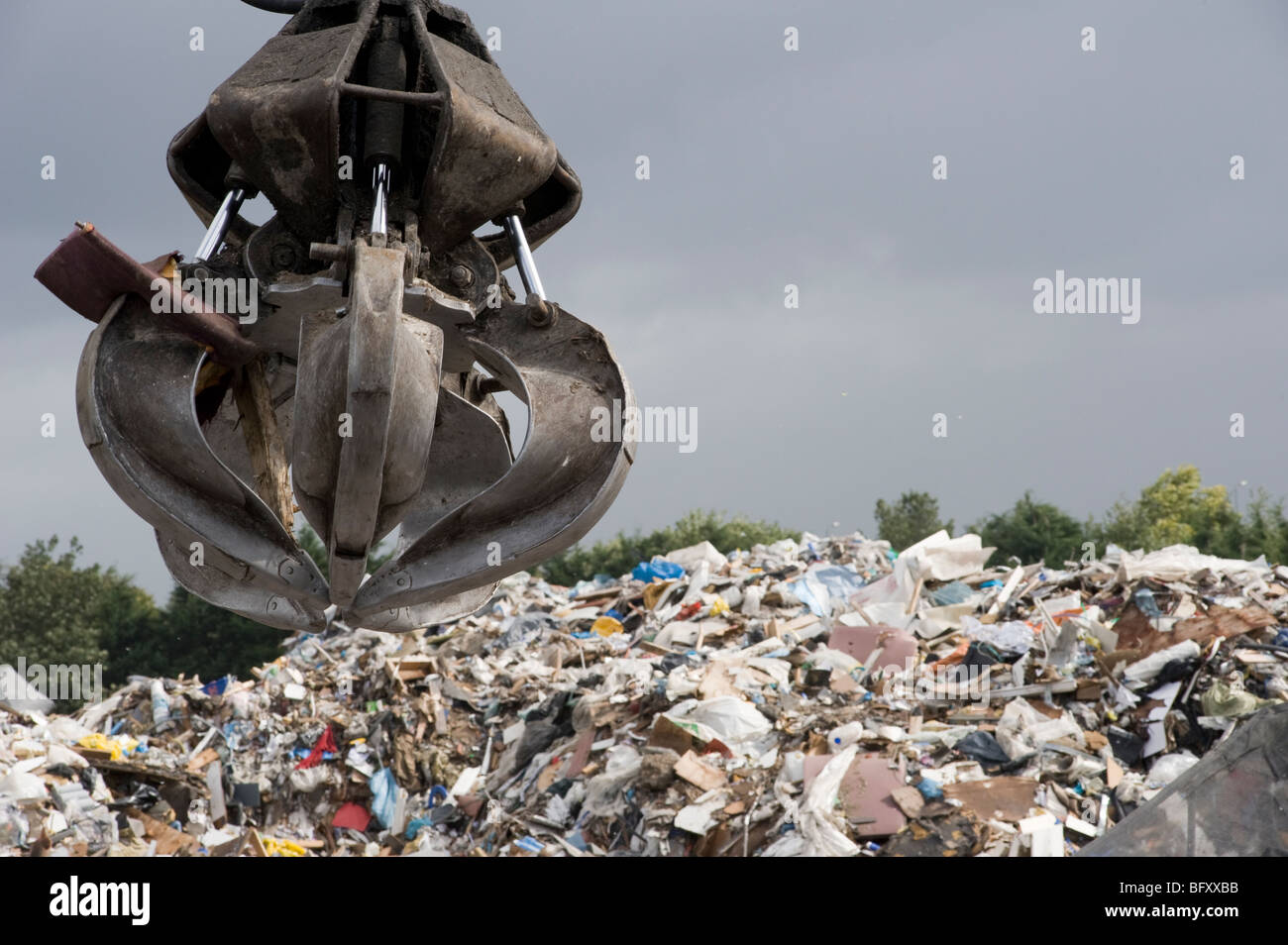 Close up of a mechanical grabber at a materials recycling facility in England. Stock Photo