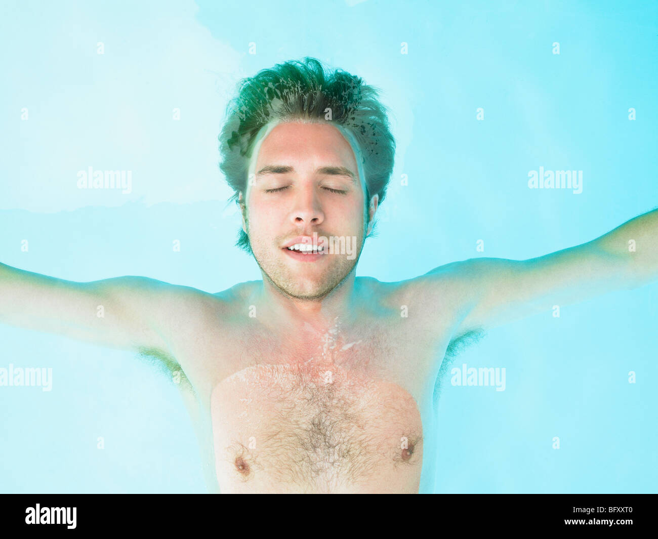 young man floating in water Stock Photo Alamy