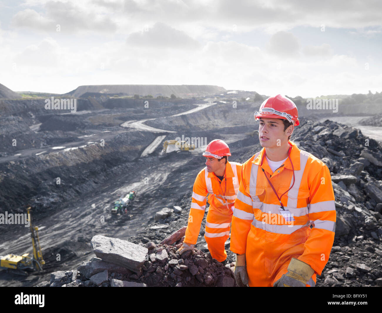 Workers Looking Over Coal Mine Stock Photo