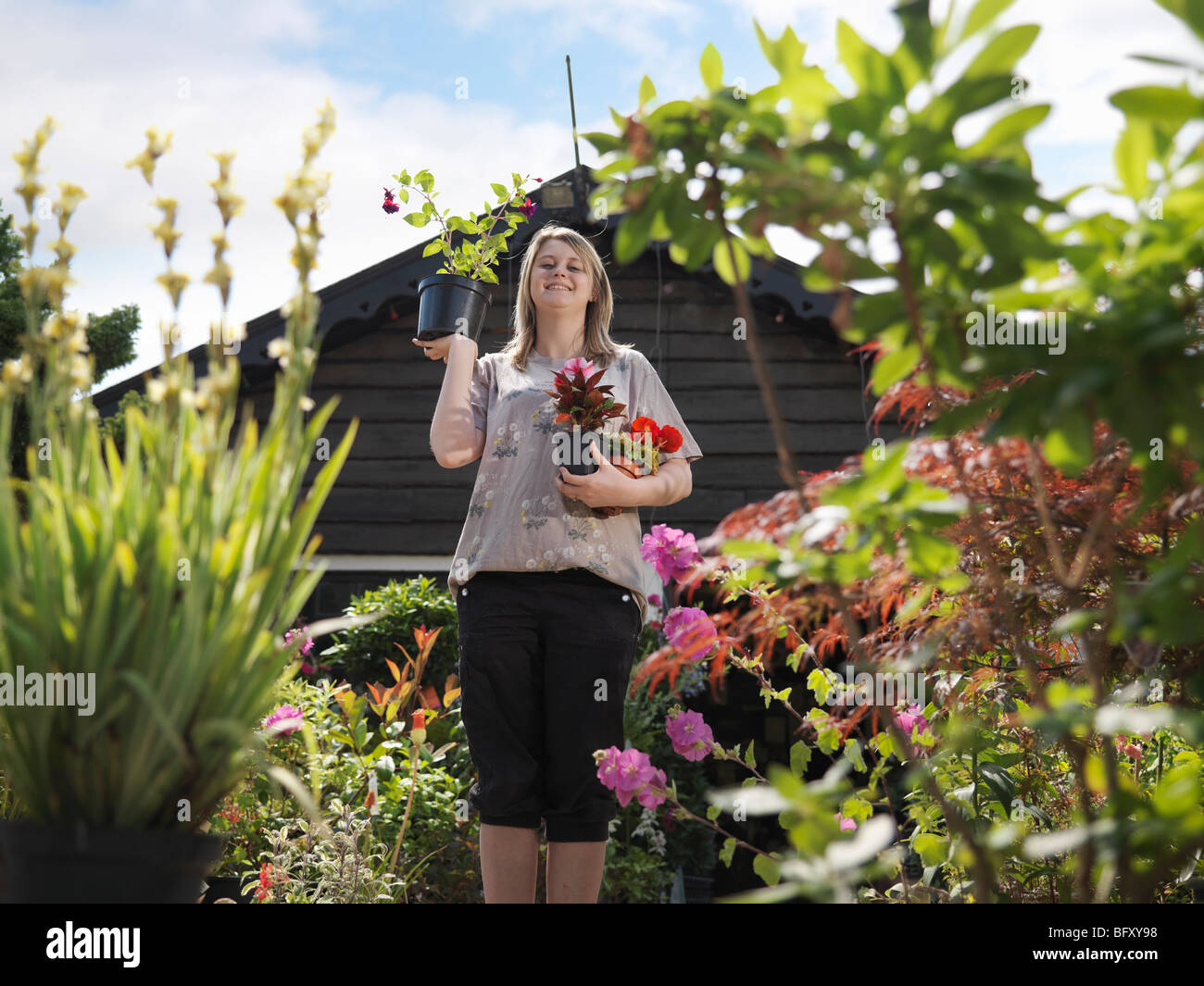 Garden centre shopper looking at plants hi-res stock photography and ...