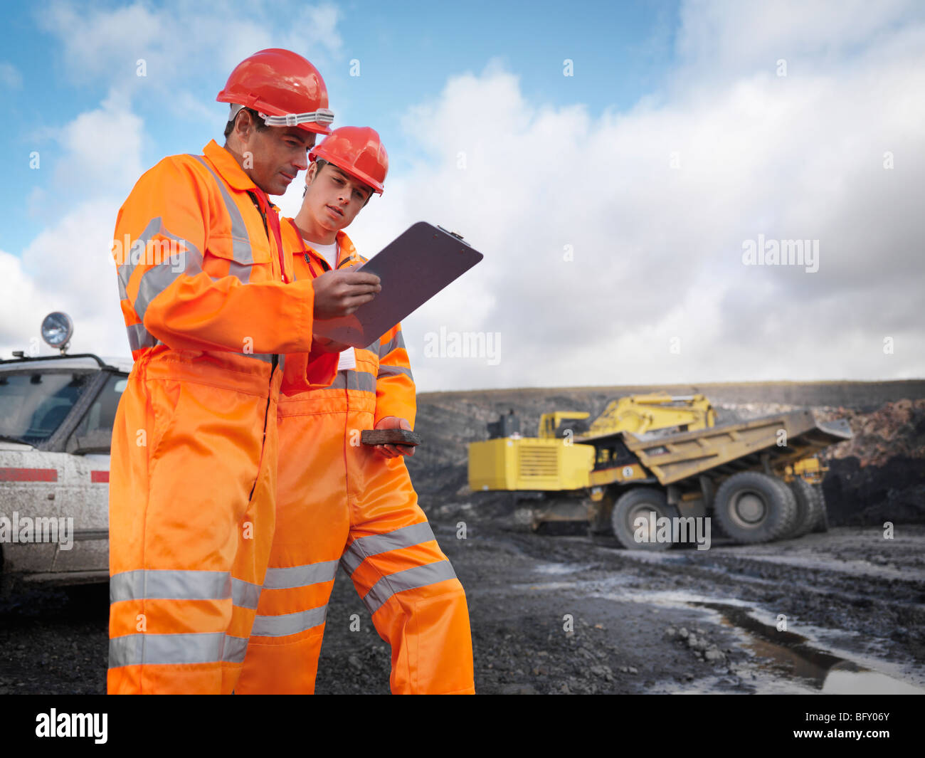 Workers With Clipboard In Coal Mine Stock Photo Alamy
