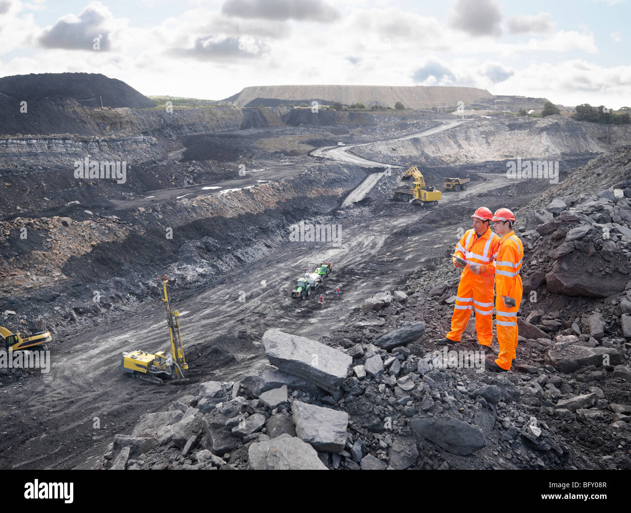 Workers Looking Over Coal Mine Stock Photo