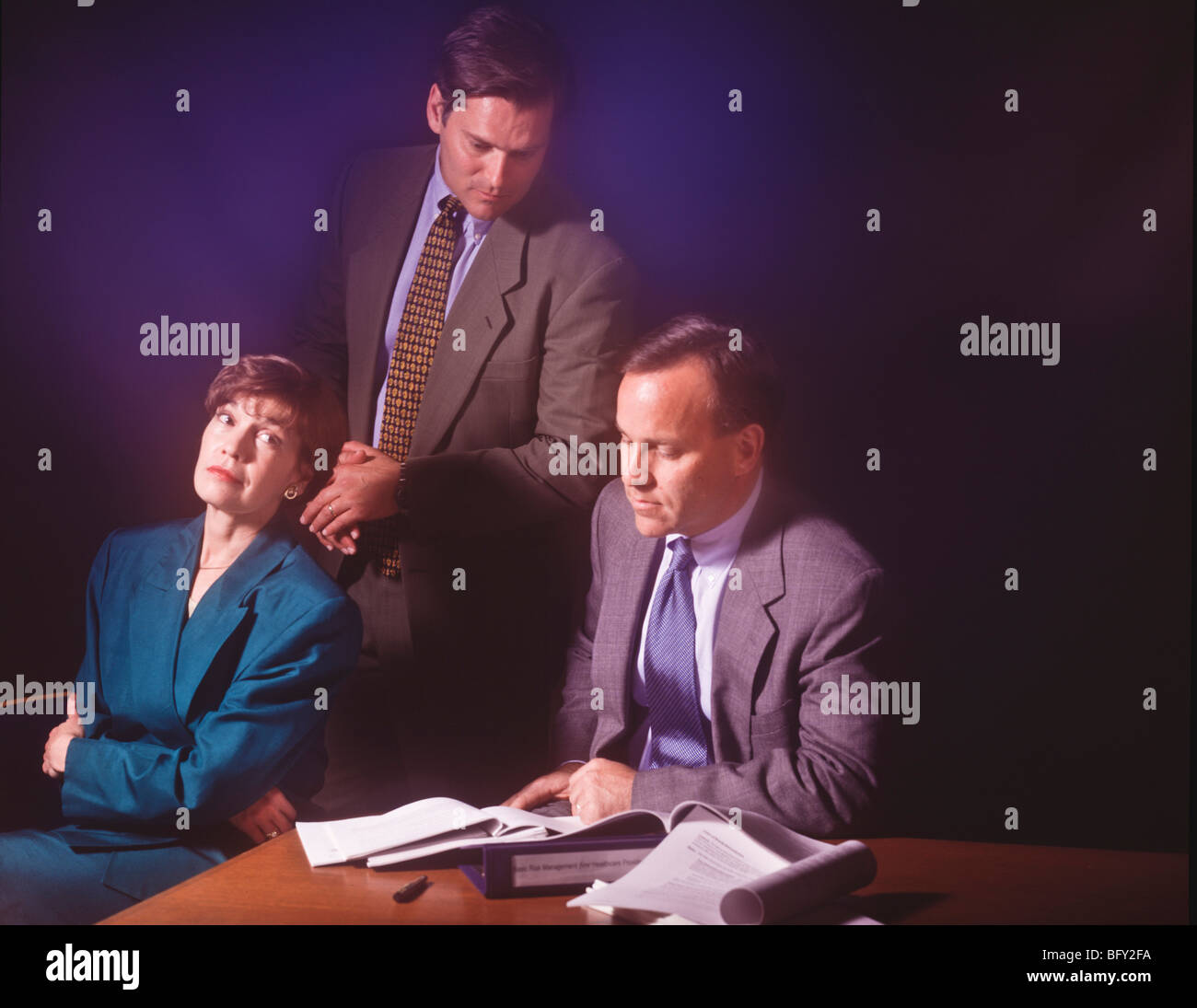 Group of office workers in conference meeting reacting while trying to reach agreement on corporate plans. Stock Photo