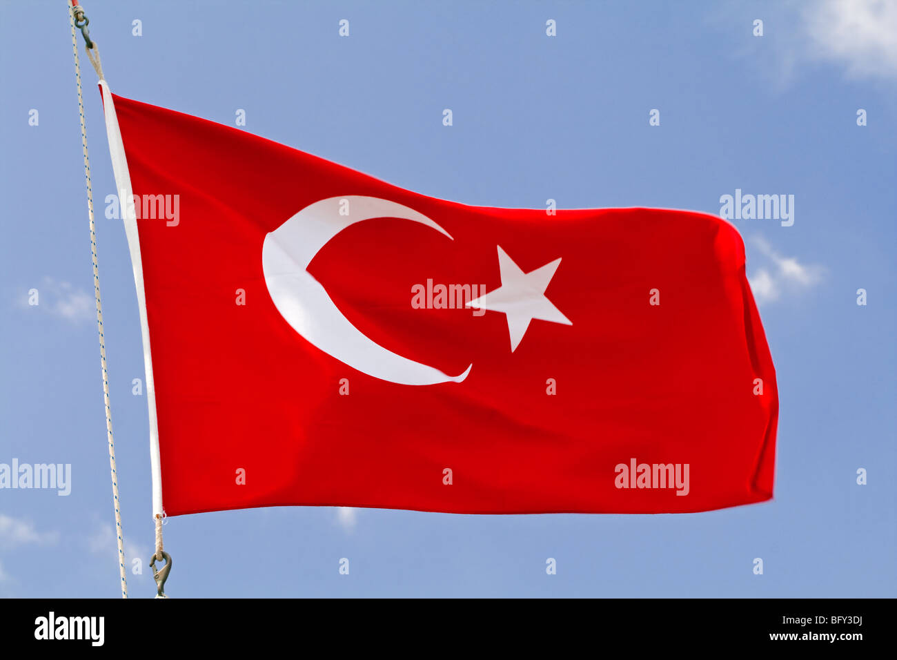 The flag of Turkey red with a white crescent moon and a star in its centre. The flag is called Ay Yıldız or Alsancak  in Turkish Stock Photo