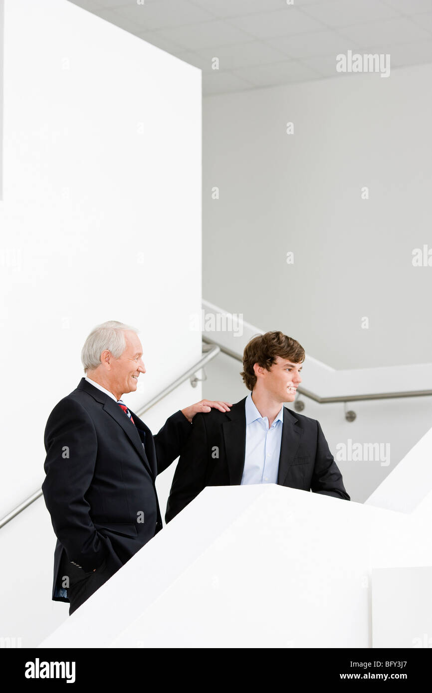 two businessmen on staircase Stock Photo - Alamy