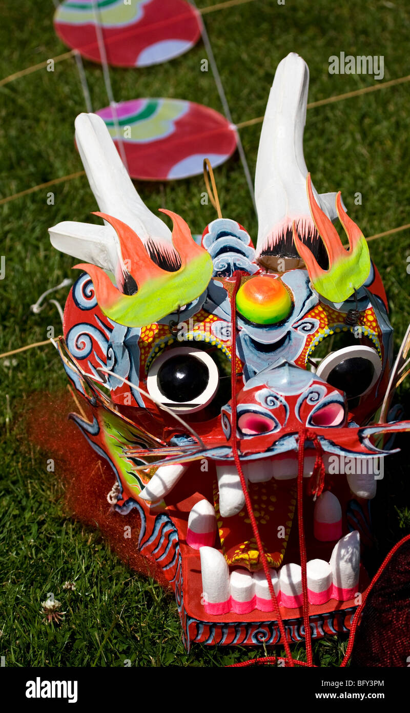 Colourful dragon's head of a chinese dragon kite lying on the ground Stock Photo