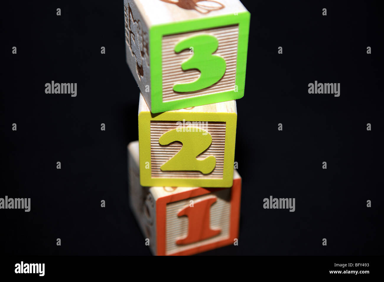 1 2 3 children's building blocks against a black background Stock Photo