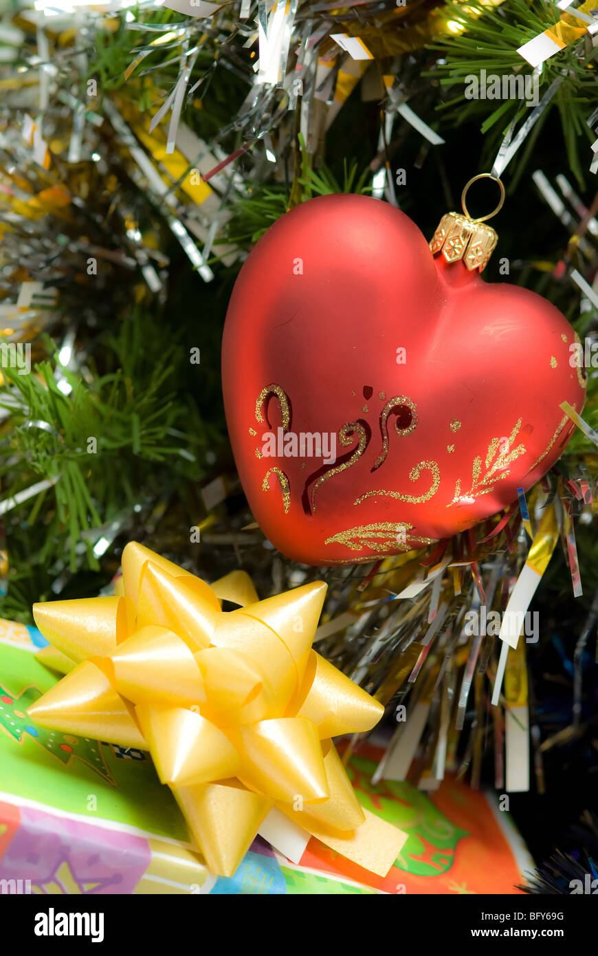 red heart on fir branch with gift box Stock Photo