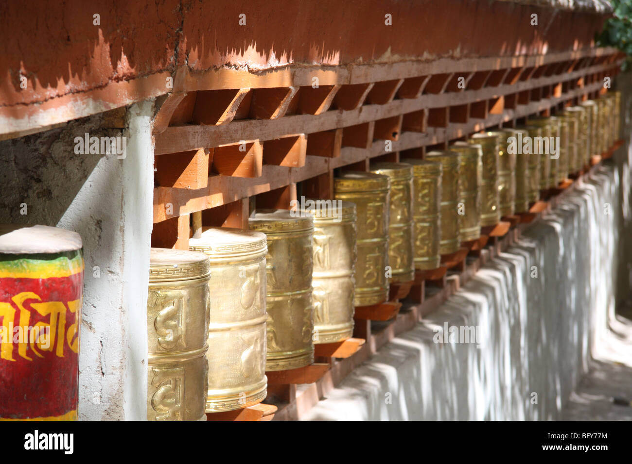 Tibetan prayer wheels in the sun at Alchi Buddhist monastery founded by Rinchen Zangpo near Leh, Ladakh, northern India Stock Photo