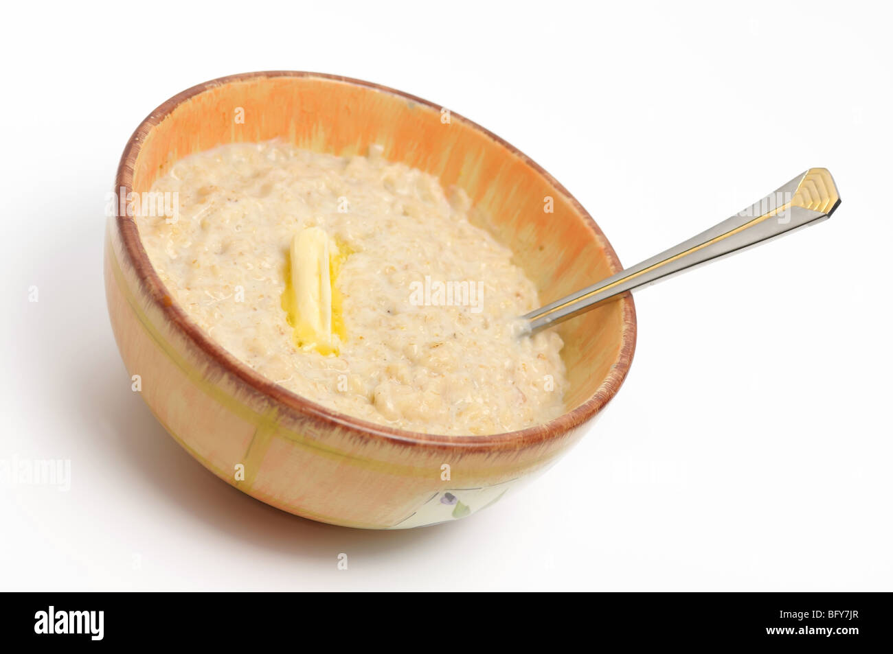 Hot morning porridge with butter on a white background Stock Photo