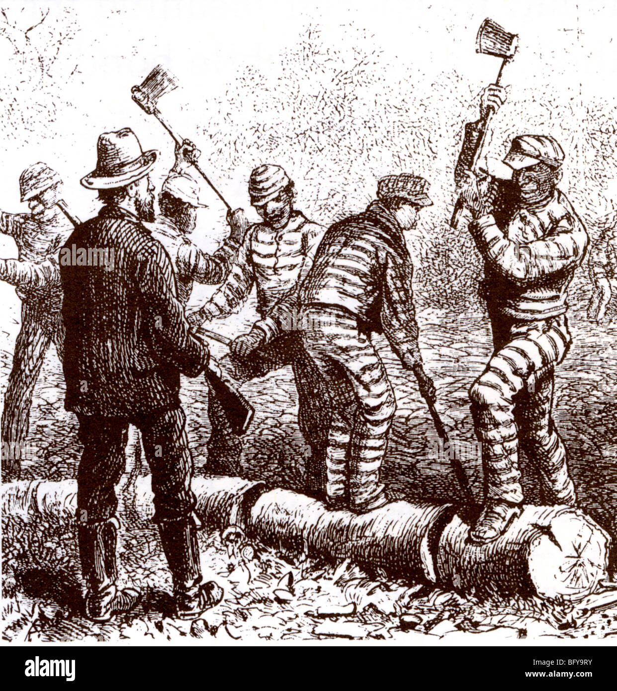 CHAIN GANG Black prisoners chopping logs at a 19th century US jail Stock Photo