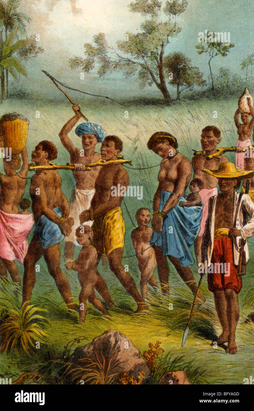 CAPTURED AFRICAN SLAVES under watchful eye of the slave master at right Stock Photo