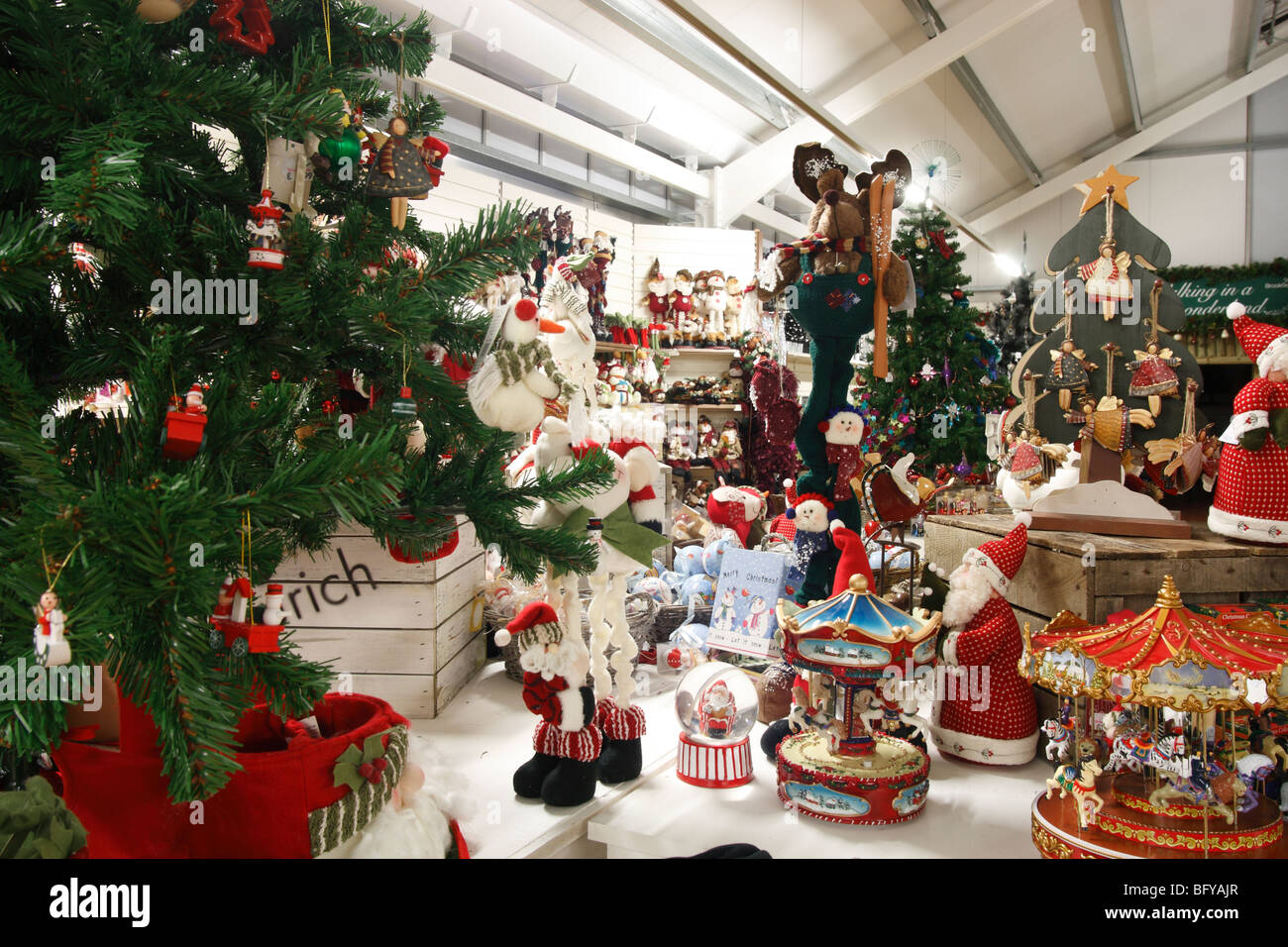 A Snow Man Father Christmas And Other Christmas Decorations On Sale Stock Photo Alamy