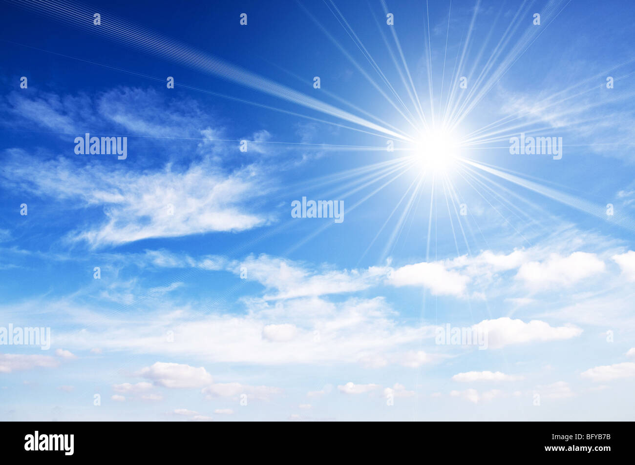 Bright sun against blue sky Stock Photo