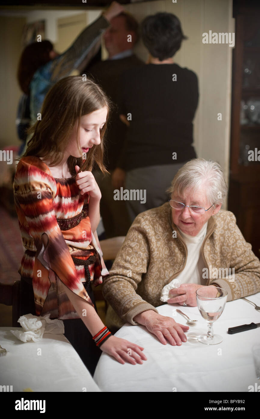 grandchild and grandmother compare hands Stock Photo