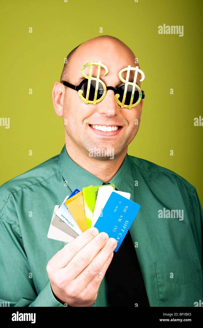 Businessman wearing dollar sign sunglasses hires stock photography and