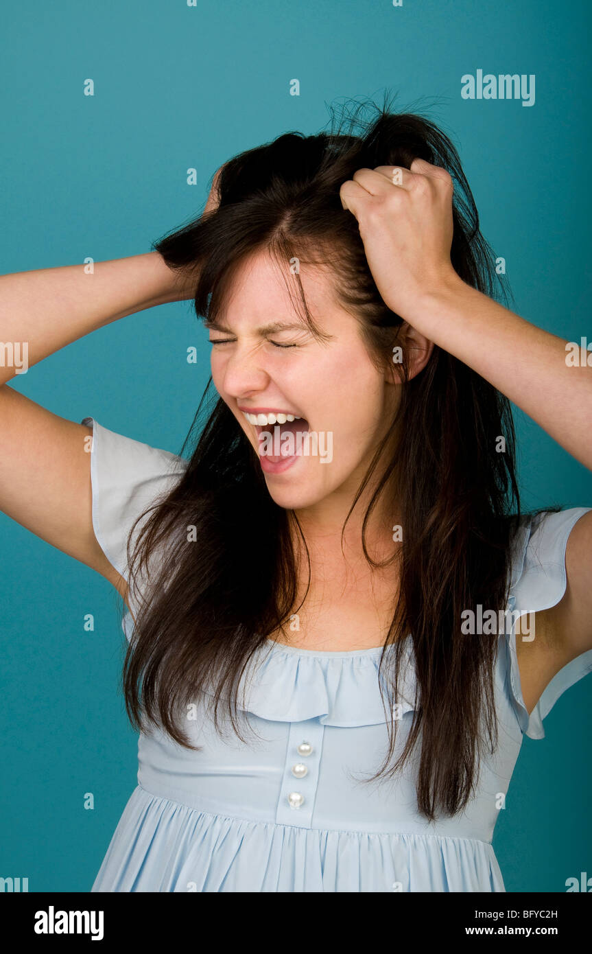 Angry woman pulling hair standing hires stock photography and images Alamy