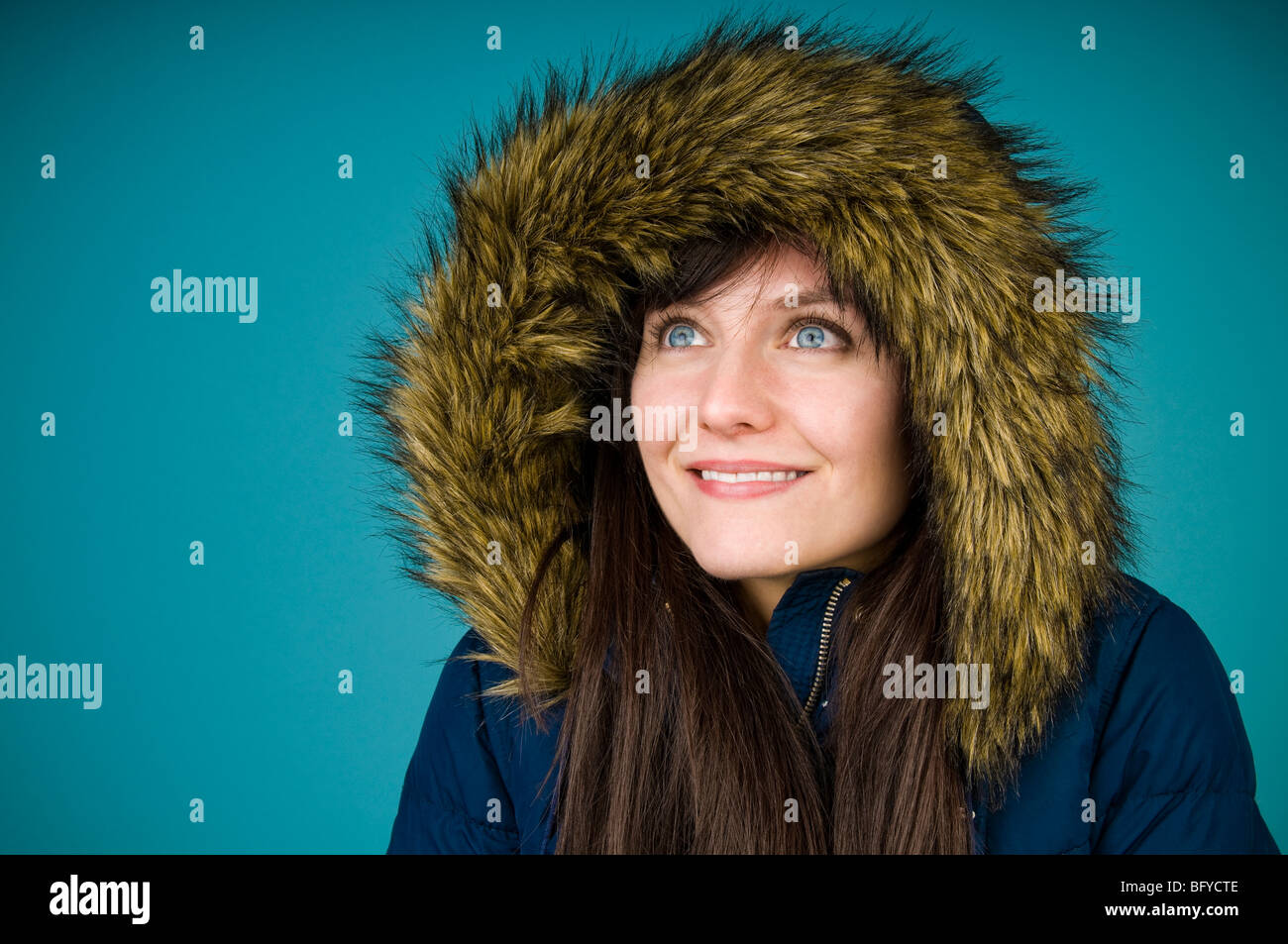 Woman wearing fur-lined parka Stock Photo