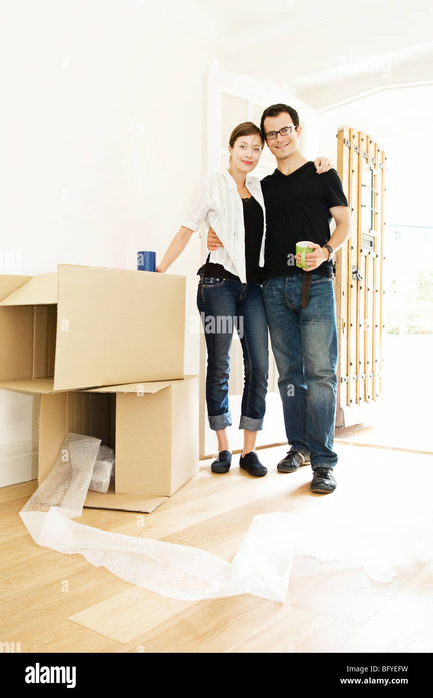 A young couple in their new home Stock Photo - Alamy