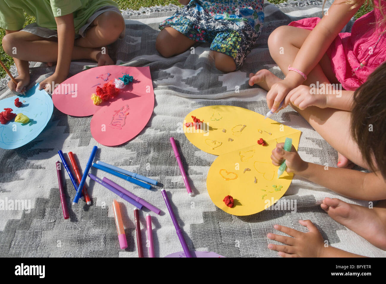 Children making paper hearts Stock Photo - Alamy