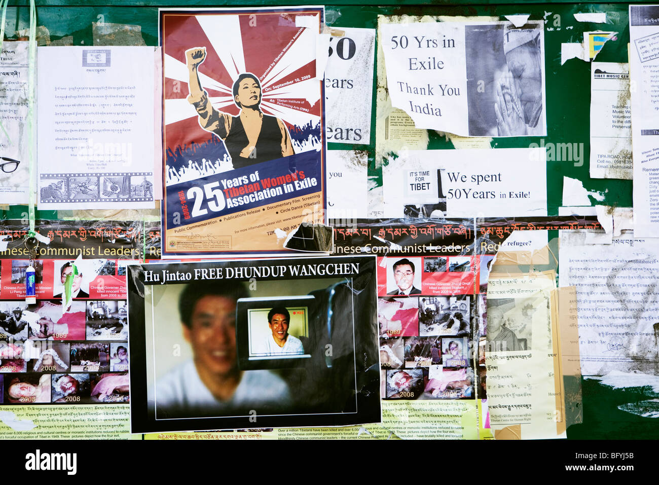 Propaganda posters on the wall in Dharamsala, India, oppose the Chinese occupation of Tibet. Stock Photo