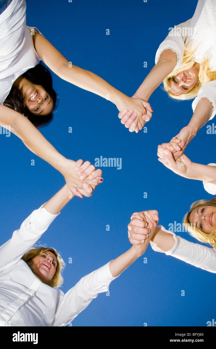 Women holding hands Stock Photo Alamy