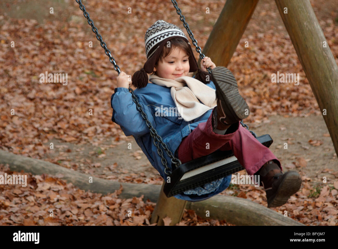Girl on a swing Stock Photo