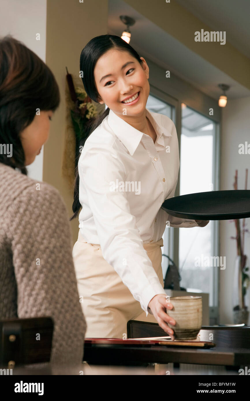 young-japanese-waitress-serving-guest-at-restaurant-stock-photo-alamy