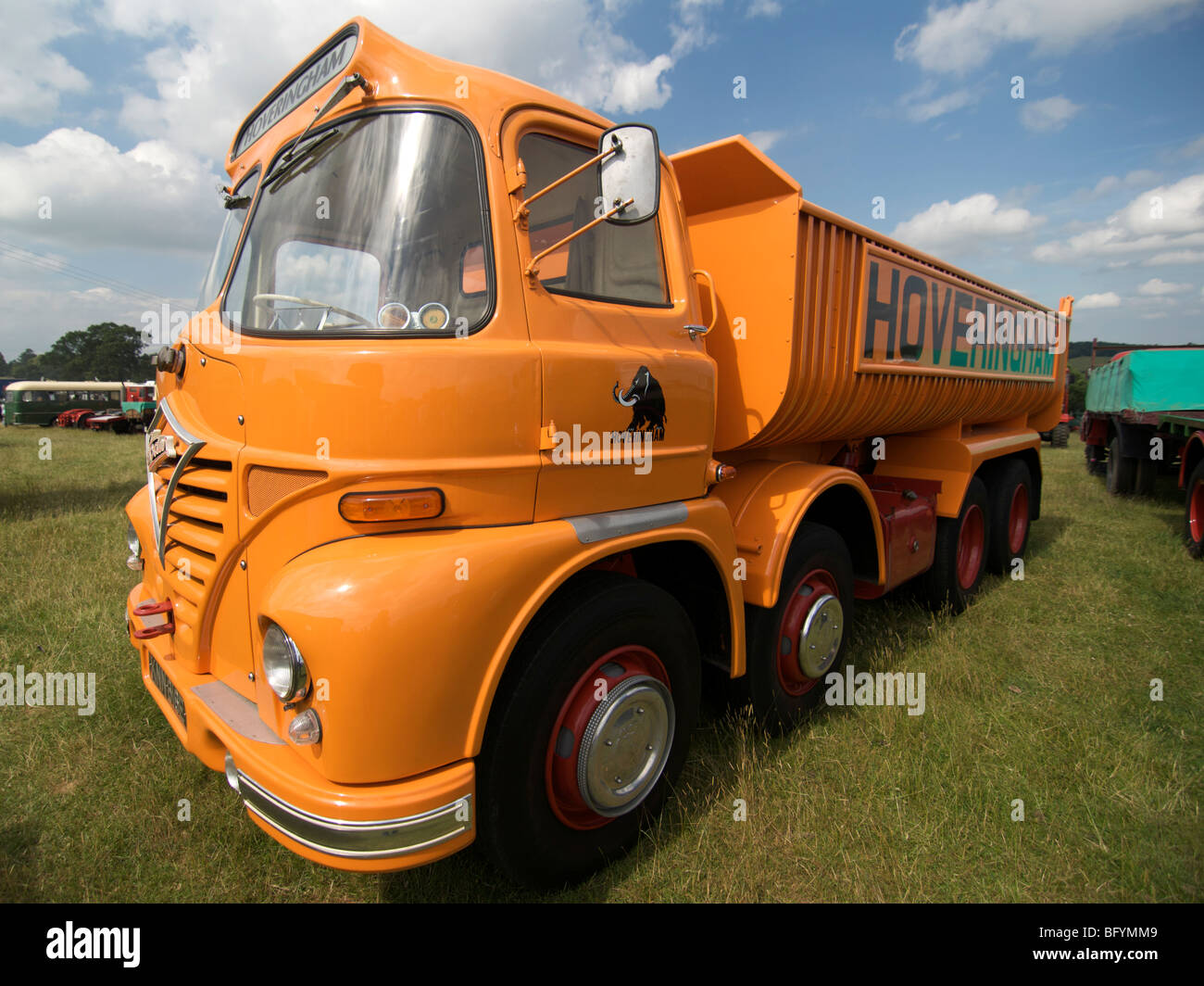 Wide angle shot of an orange Foden S21 Hoveringham tipper seen in 2009 at the Hollowell Steam Rally Stock Photo