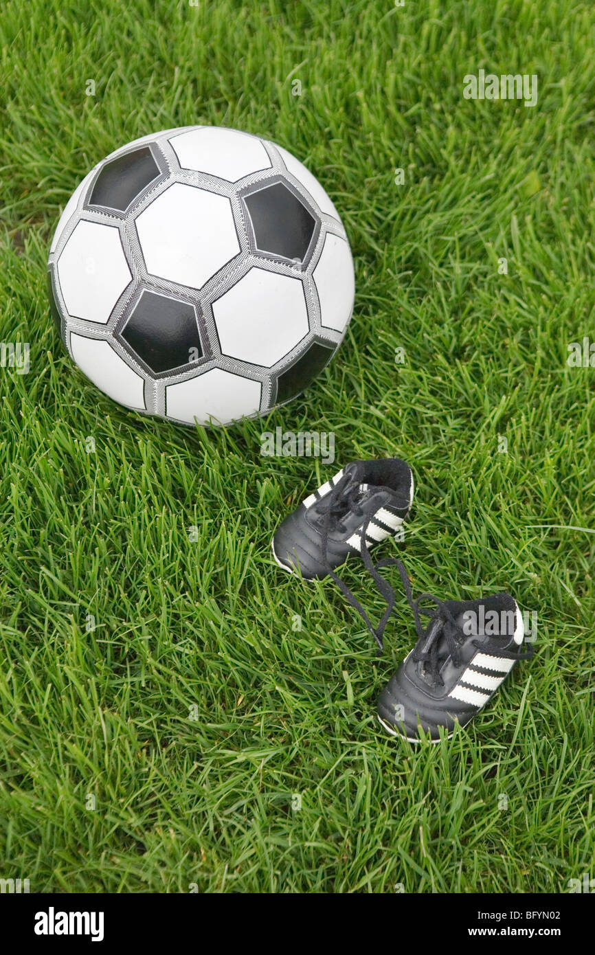 still life of ball and tiny football boots Stock Photo - Alamy