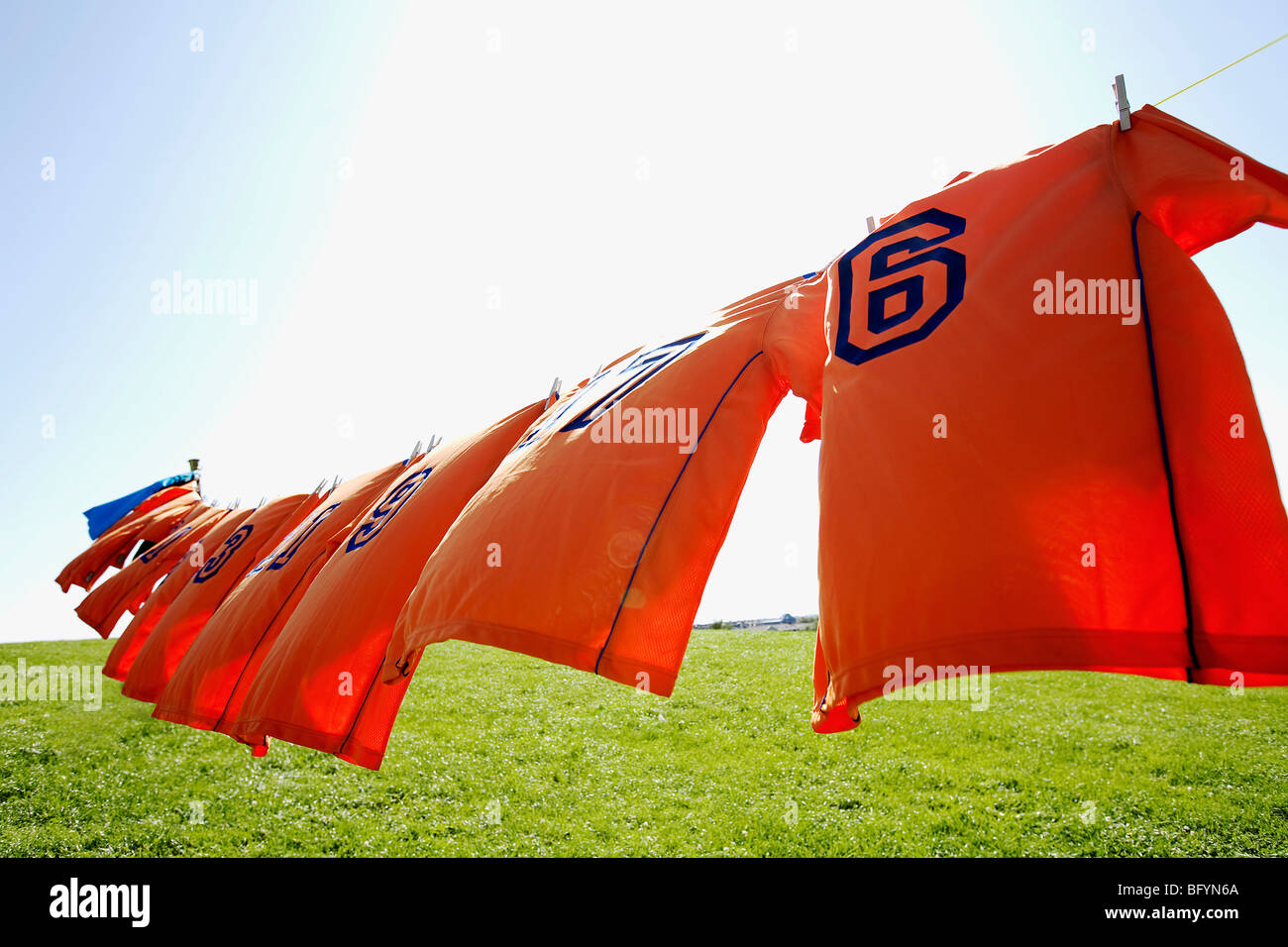 football dresses hanging on clothesline Stock Photo